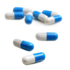 blue & white capsules isolated on white