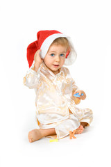Cheerful baby girl wearing Santa Claus hat