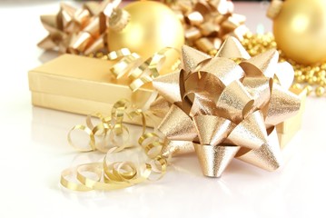 Gold gift boxes ribbons bows ornaments and holiday decorations