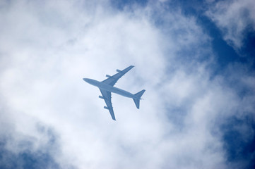 Fototapeta na wymiar Passanger's plane surrounded with white clouds.
