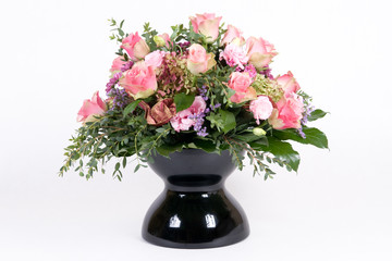 Beautiful bouquet with pink roses in black vase