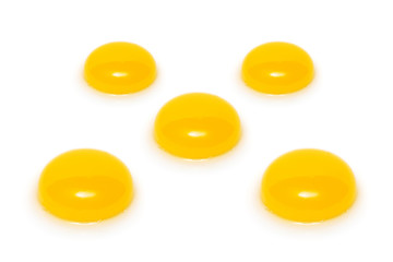 Close up of five yolks isolated on white background.