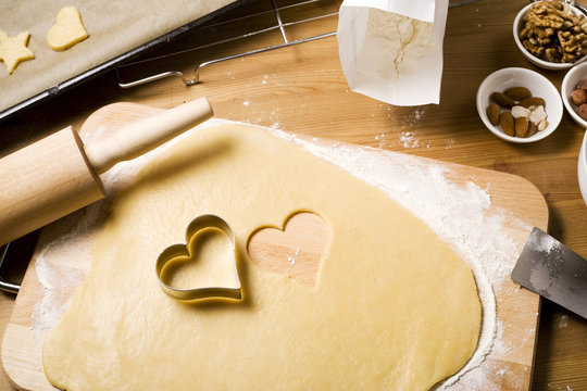 baking scenery with heart shaped cookie cutter, ingredients