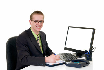 Handsome young successful businessman in the office