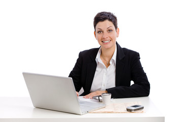 Businesswoman working at desk, isolated on white.