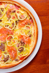 tomato pizza on plate.Italian kitchen.Close-up