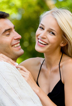 Young happy smiling attractive couple outdoors
