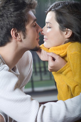 Young couple kissing, outdoors