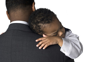 Portrait of an African American father holding his sleeping son - Powered by Adobe