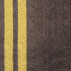Double yellow line on asphalt texture
