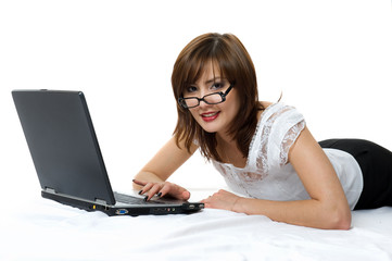 businesswoman with laptop lying on the floor.