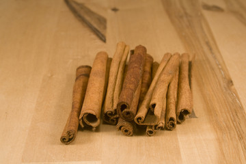 Cinnamon sticks on wood