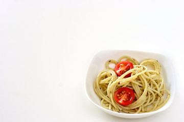 Plain pasta olio in small square shaped bowl