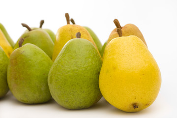 yellow and green pears on white with copy space