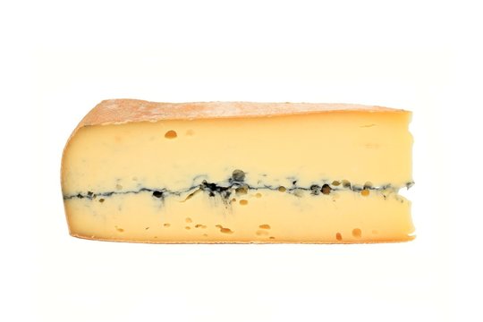 Slice of french cheese, Morbier variety; isolation on white