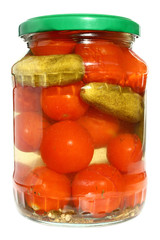 Tinned vegetables in glass bank on a white background.