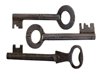 Three old steel keys over white background