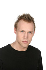 Fototapeta premium young man in black shirt with serious face and stubble