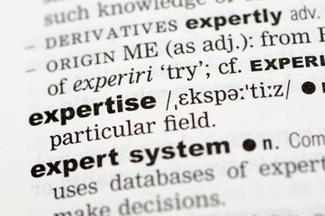 A close up of the word expertise from a dictionary