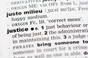 A close up of the word justice from a dictionary