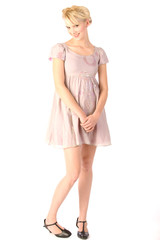 Infantile flirting blonde in pink mini dress