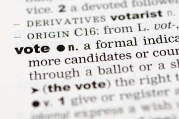 A close up of the word vote from a dictionary