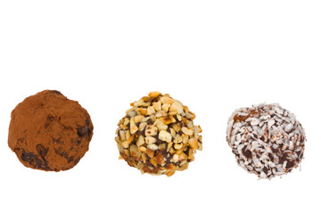 closeup of three home made chocolate pralines