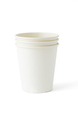 Stack of three disposable paper cups on white background