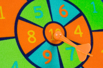Closeup of the bullseye of a toy dart board.
