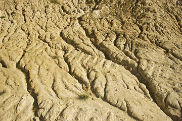 Closeup of dried out brown eroded soil.
