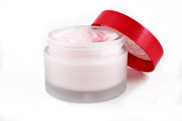 Open beauty cream jar on white background
