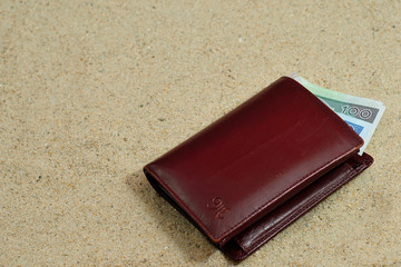 Lost wallet laying on the beach