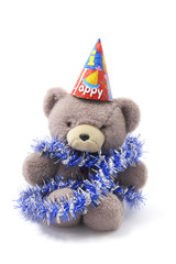 Teddy Bear with Party Hat and Tinsel on White Background