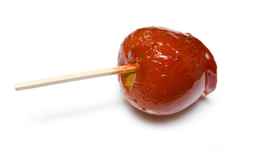 Toffee apple isolated on a white studio background