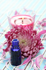 essential oil beautiful pink petals and aromatic candle