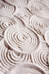 Fototapeta na wymiar Abstrakcyjnym koła w tle piasku