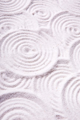 Fototapeta na wymiar An abstract circles in sand background