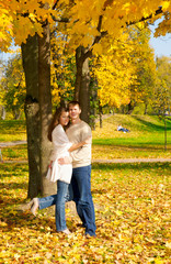 Happy young couple in love meeting in the autumn park