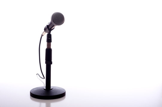 A microphone on a white background with copy space