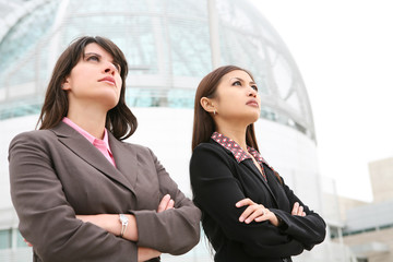 Pretty diverse young business woman at office building