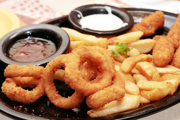 assorted appetizers served with tomato and cheese dips.
