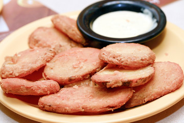 potato appetizers served with garlic flavored dip.