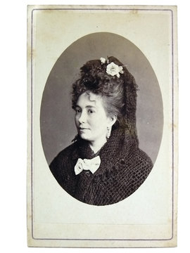 Vintage portrait of woman early 20 century on background.