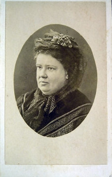Vintage portrait of woman early 20 century on background.