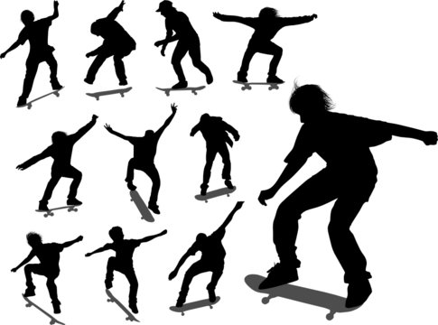 Silhouettes of some skateboarders