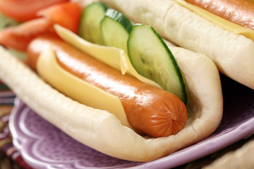 two fresh and delicious hot dogs with vegetables