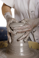 Close-up picture of a potter works a potter's wheel