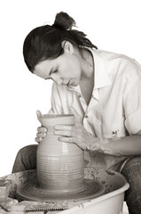 Picture of a potter works a potter's wheel
