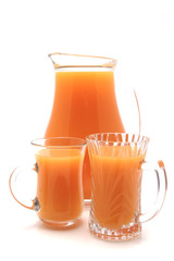 one transparent liter pitcher and two glasses