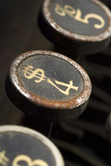 a dollar symbol on a typewriter key